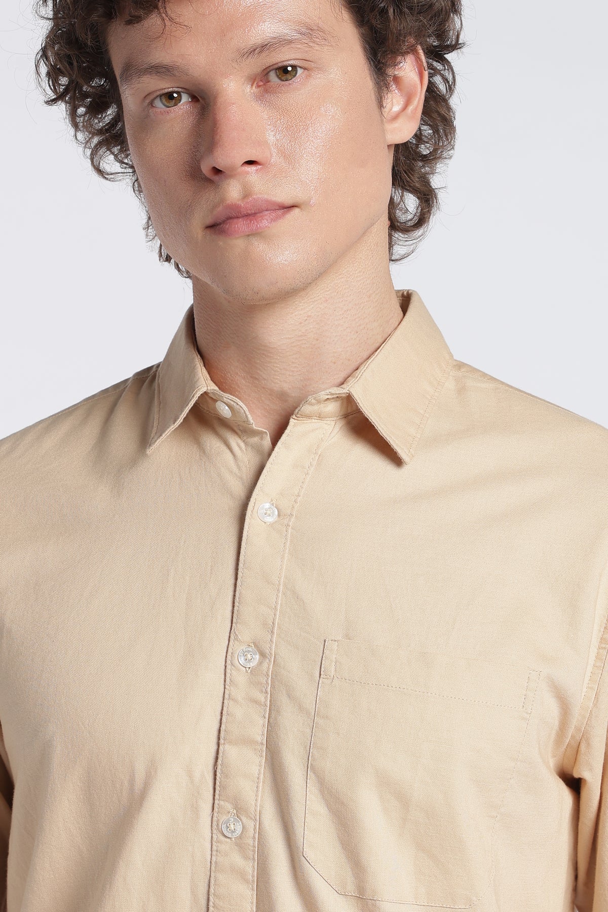 Angled front view of light brown full-sleeve shirt