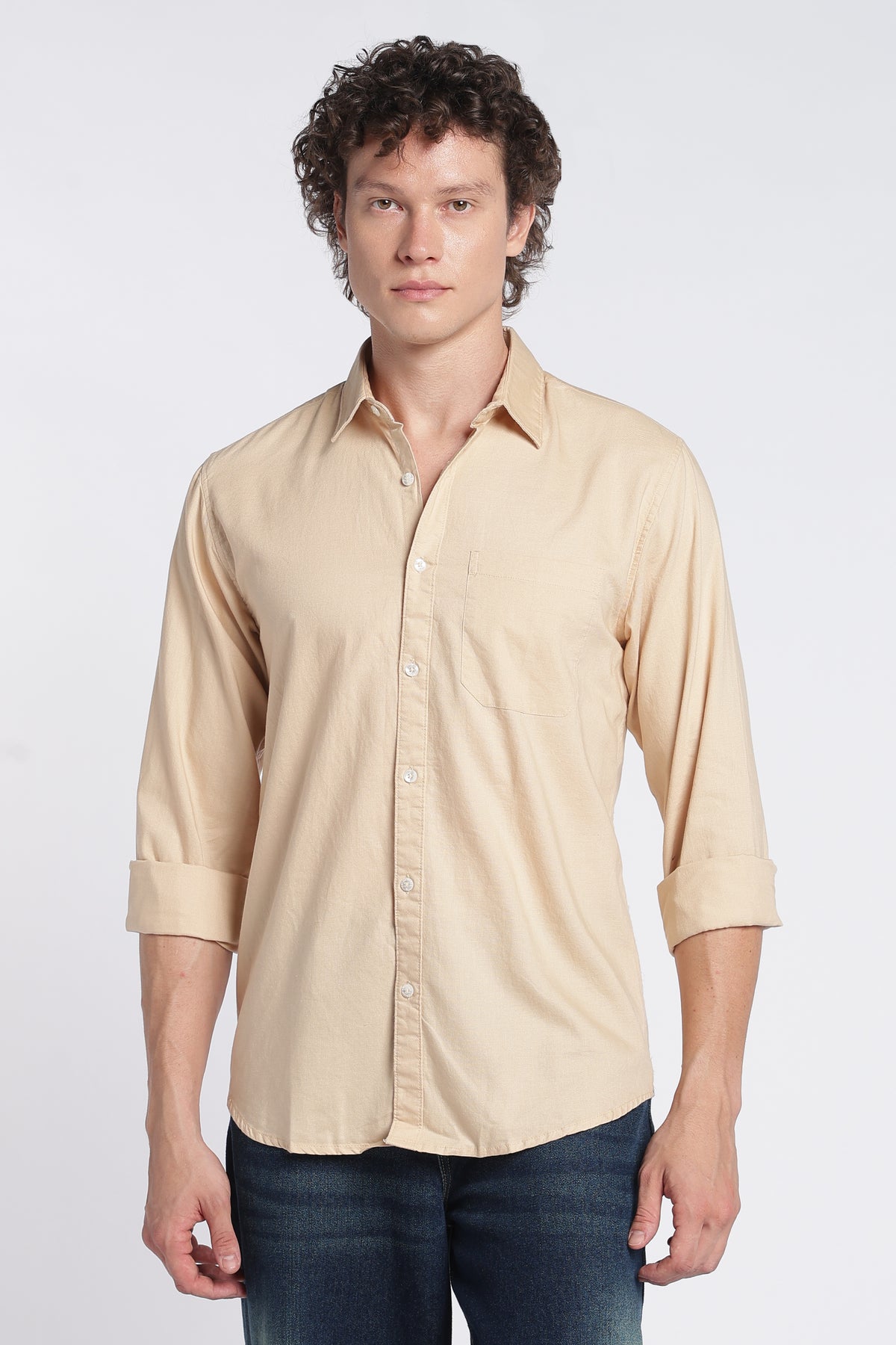 Three-quarter view of men's light brown Oxford shirt